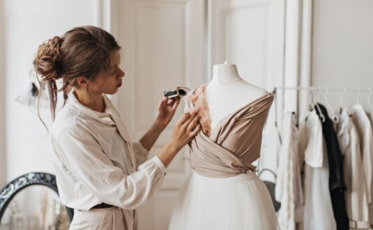 A female designer creating an outfit in a studio
