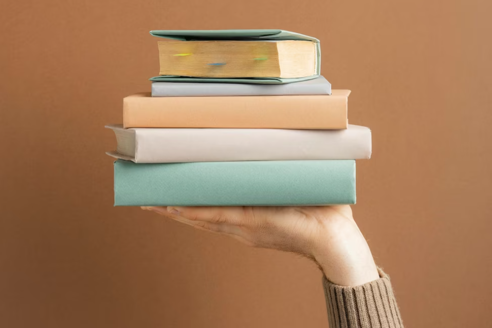 hand holding a block of books