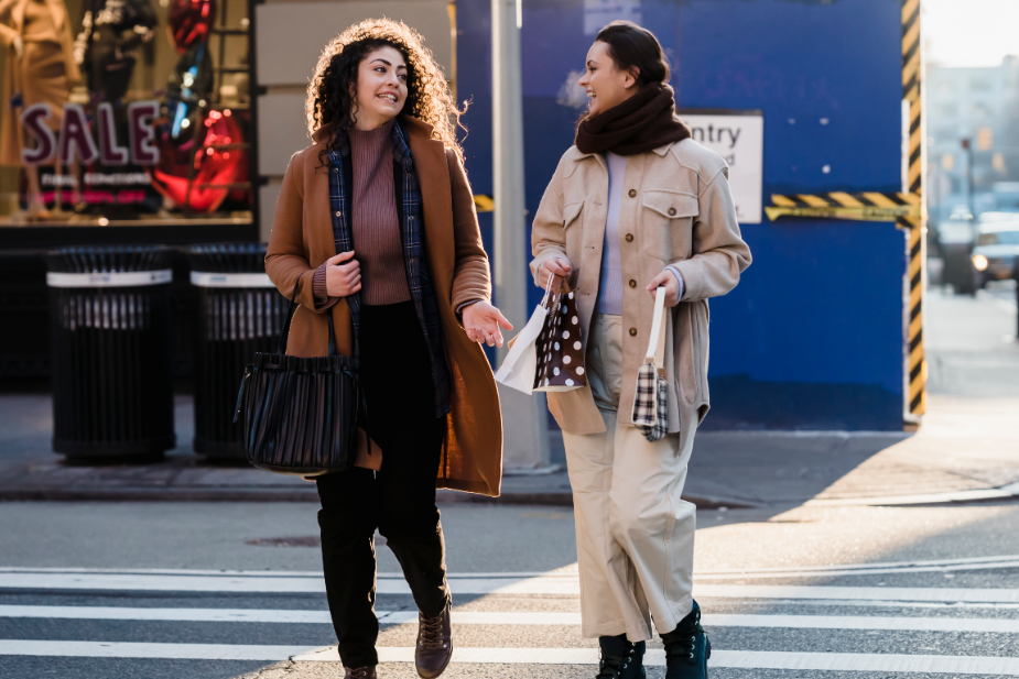 two women walking and chatting while representing NY street style fashion